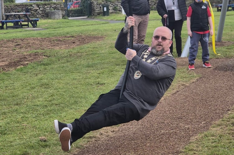 Portreeve and Mayor, Cllr Steven Pound, set the tone by bravely hopping on and zipping down the line