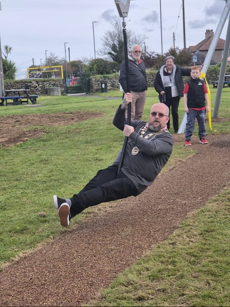 Portreeve and Mayor, Cllr Steven Pound, set the tone by bravely hopping on and zipping down the line