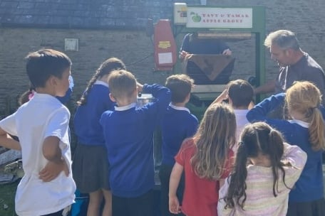 Learning all about the apple press by Buckland Monachorum School.