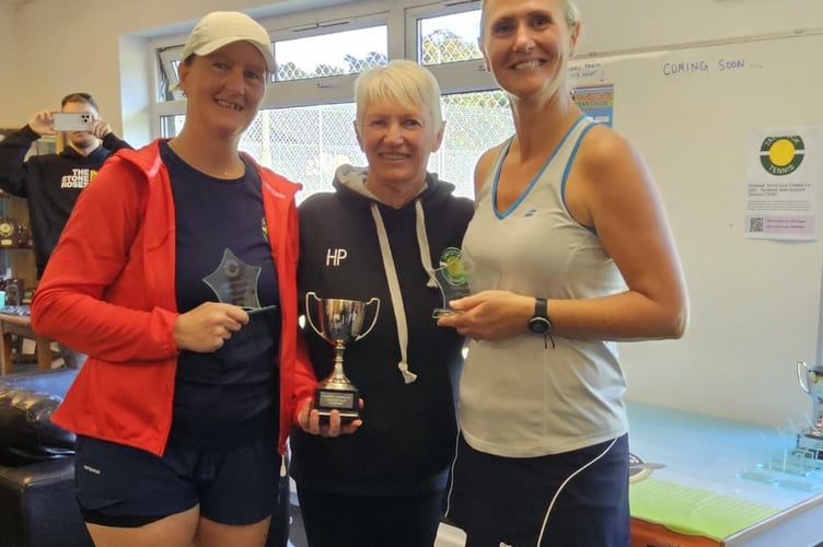 Ladies' doubles winners Lisa Hackney, left, and Frances Lindsey, right, presented with their trophy by ladies' captain Hilary Picton.