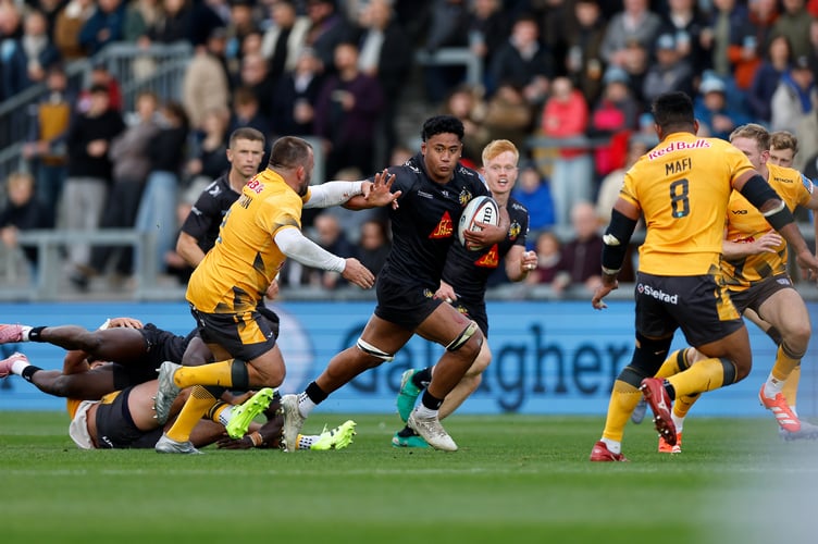 Exeter Chiefs forward Greg Fisilau breaks clear of Newcastle Red Bulls hooker George McGuigan at Sandy Park