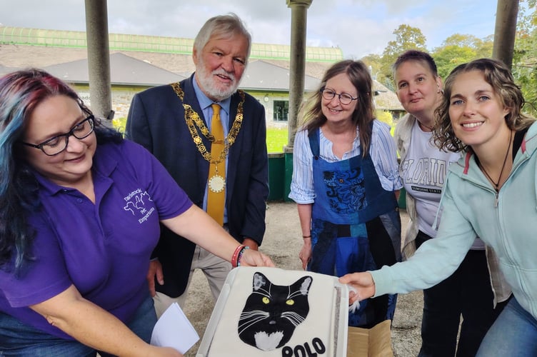 Debbie Walsh, Tavistock Pet Emporium owner, Tavistock Mayor Cllr Steve Hipsey, Chris Lennox, grandmother of Polo's owner Reese, 9, Jen Horne, Polo's publicist, and Hayley Clarke, Reese's mum.