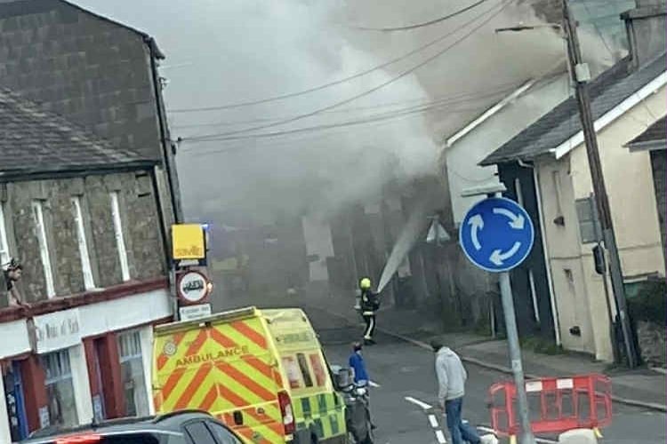 Firefighters tackling the fire in Ford Street. Picture: Contributed