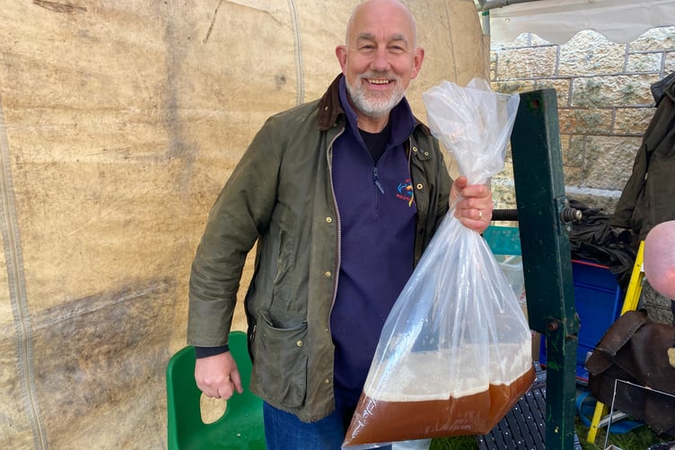 Helping produce apple juice from locals' own apple harvest at Bere Applefest.