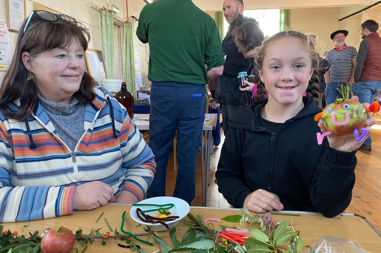 Apple art at Bere Ferrers, with stallholder XX and creative youngster XX XX