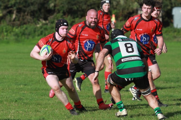 Moorlander Henry Shaw steps the defender.