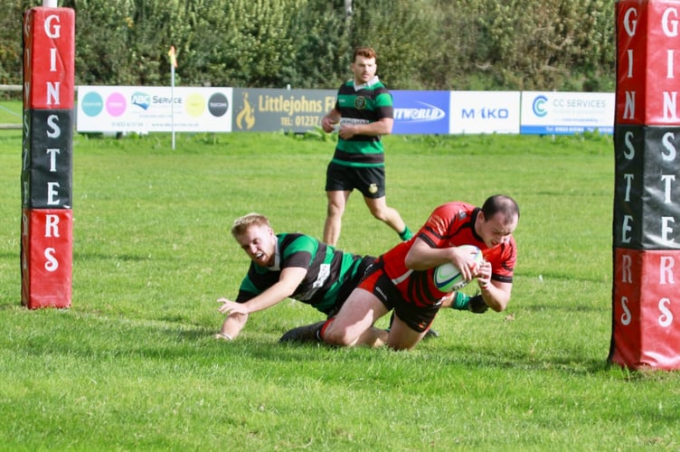 Liam Watts goes over for one of his hat trip of tries for the Moorlanders.