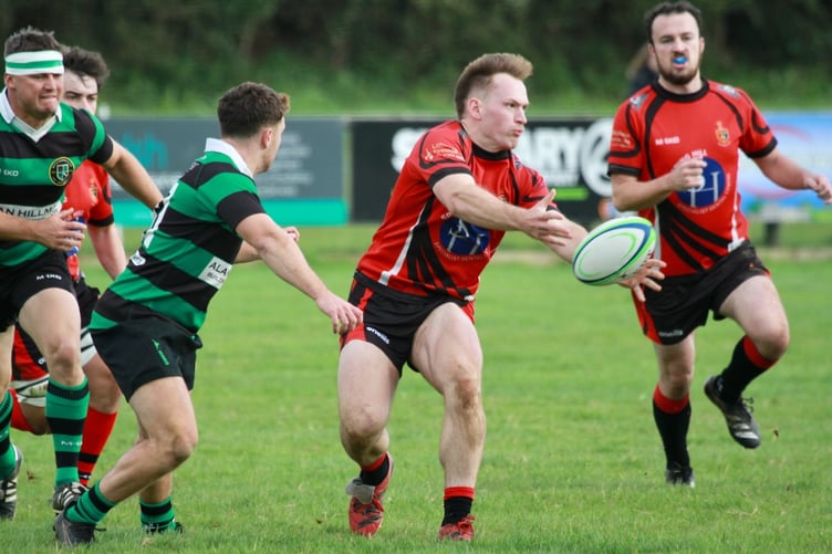 Toby Teague moves the ball for Tavistock RFC.