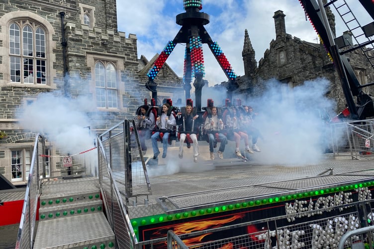 Youngsters enjoying the fun fair on Bedford Square on their day off to soak up the atmosphere of Tavistock Goose Fair today.