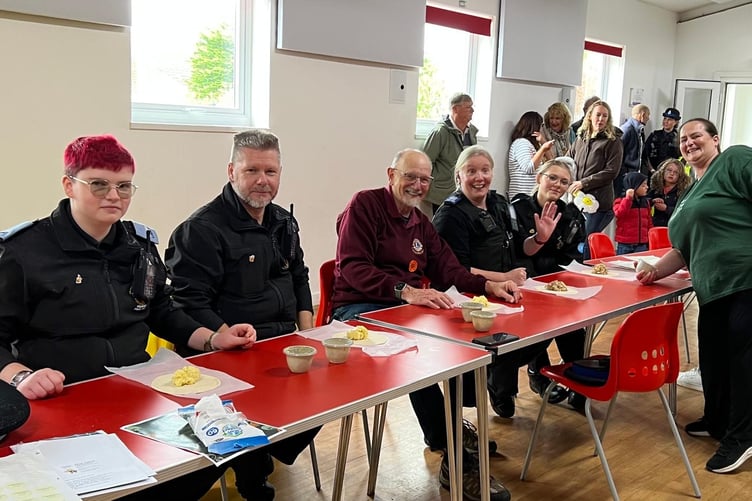 The local Callington policing team perfecting their crimping skills hosted by The Cornwall Bakery at the Callington Lions Buzz Off Amy event.