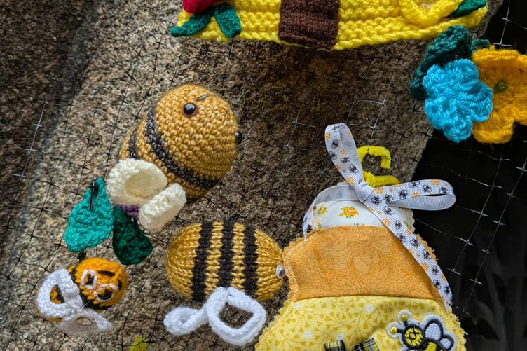 Beautifully crafted bee hives and bees adorned the archway to Honey Fair celebrations at St Mary's parish church.
