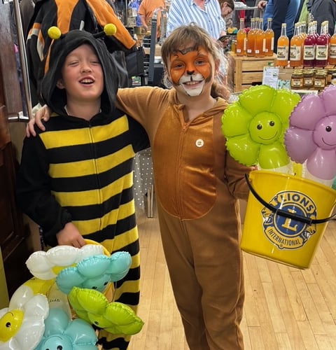 Callington Lions mini mascots Mika Pedrick and Fletcher Worth seeking donations at the Buzz Off Amy event.  