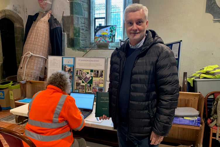 Mike Manaton regularly travels from Dallas, Texas to St Sampsons to catch up on progress, here with his 'family bible', a book charting the history of the Manatons.
