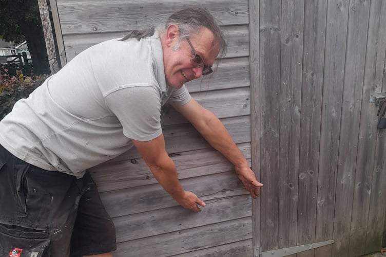 Rob Smith, Tavistock Sensory Garden head gardener, showing some of the damage by vandals to the shed.