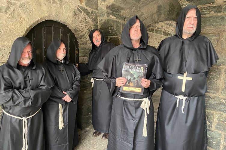 Amateur actors Paul Holliday, Mike Choroszewski, Jeff Moody, Stuart Honey (playing the final Tavistock Abbott John Peryn) and Graham Parker (Abbot Aeoflfmaer) rehearsing for the town's walk-through history play a Night in the Museum.