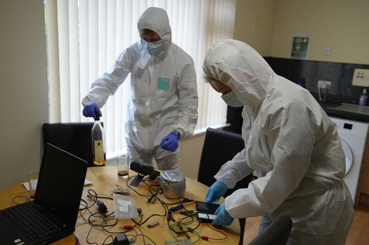 Students from Plymouth Marjon University examining a mock crime scene as part of their Forensic Programme.