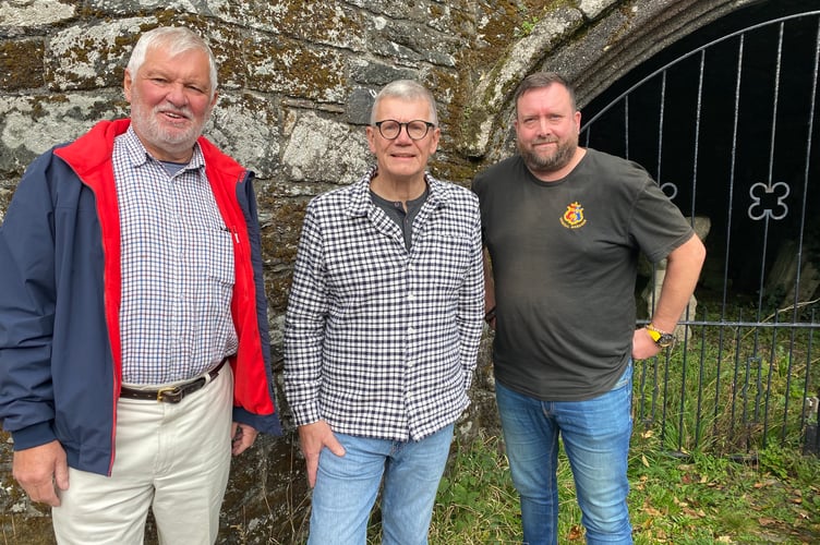 Wayne Southall (right), (Tavistock Town Council general manager), town Mayor Cllr Steve Hipsey (left) and David Conn (centre), (Tavistock Heritage Trust chair) outside Betsey Grimbal's Tower. They are celebrating the awarding of a grant to investigate the tower as part of a bigger project to unveil the secrets of the former abbey.