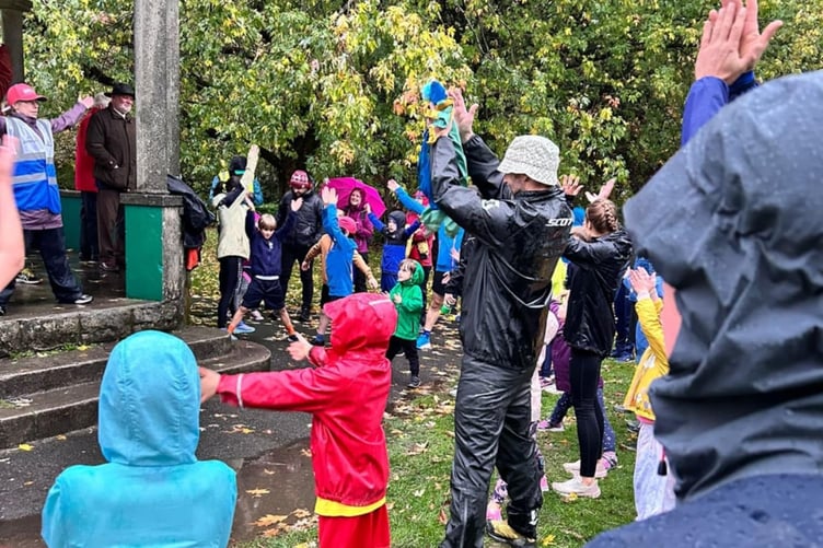 Tavistock Meadows Junior Parkrun has a warm-up session before the start. It has been hailed a success on its inaugural start, despite the rain. Picture by Richie Alexander.