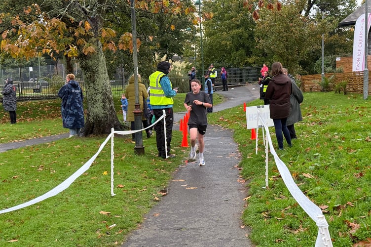 Tavistock's first junior Parkrun has been hailed a success in the Meadows, despite heavy rain. It will now continue every Sunday at 9am in the park. Pictured is a tired finisher.