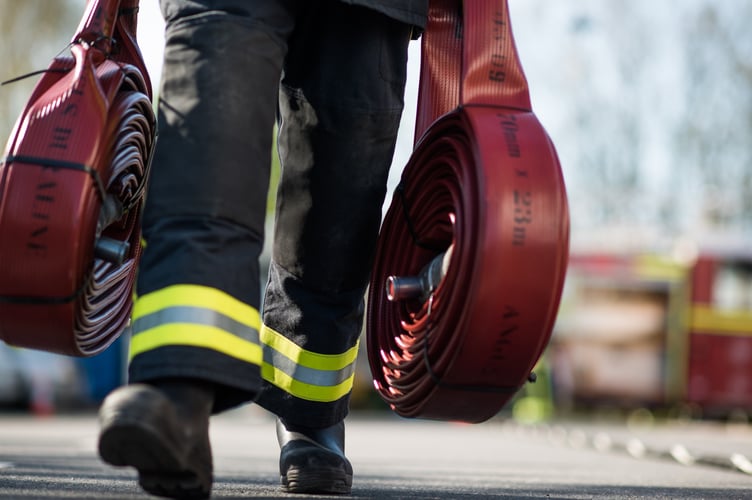 Devon and Somerset Fire and Rescue Service carrying hoses_cropped