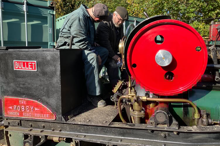 Steam engine operators at the Robey Trust Sausage and Steam Fair in Tavistock.