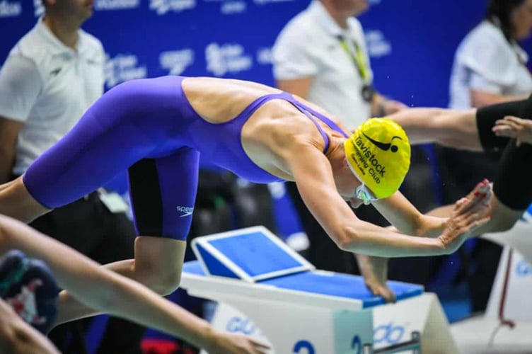 Tavistock masters medalist Sam Lake diving to success at meet.