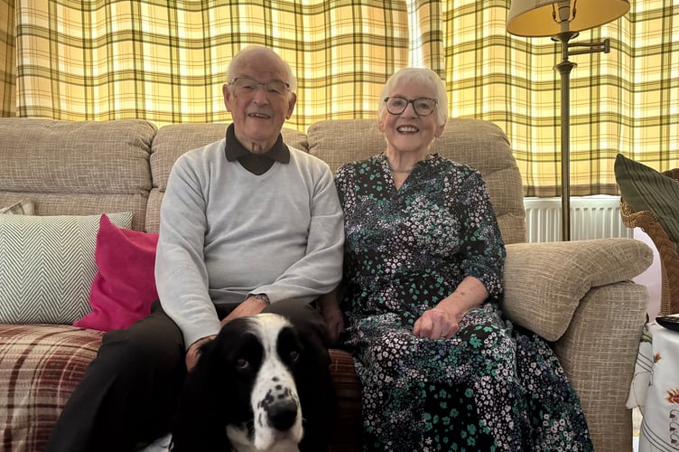 Joan and Dennis Voisin with their dog, Nipper. They celebrated their platinum wedding anniversary last week.