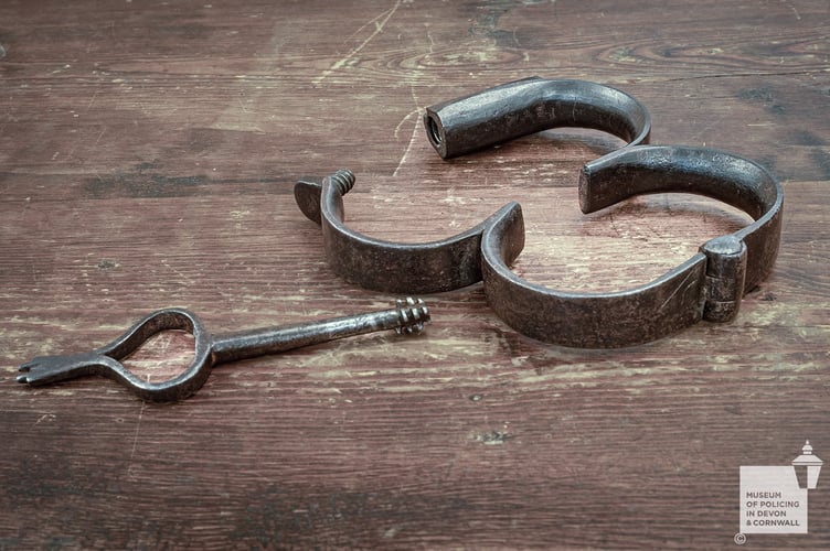 Fixed Devon & Cornwall Police iron cuffs.
