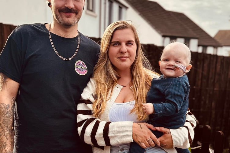 Baby Otto with parents, Sophie Reddaway, 25, and dad Paul Acreman, 27.