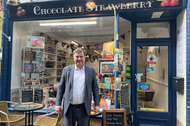 Okehampton MP Mel Stride outside 'Chocolate Strawberry' in the Okehampton Arcade.