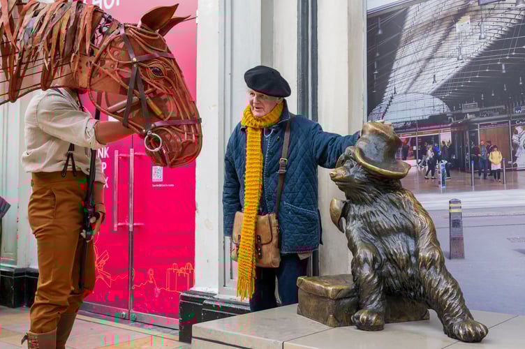 Joey and Michael stopped along the way to greet fellow children's story character, Paddington bear.