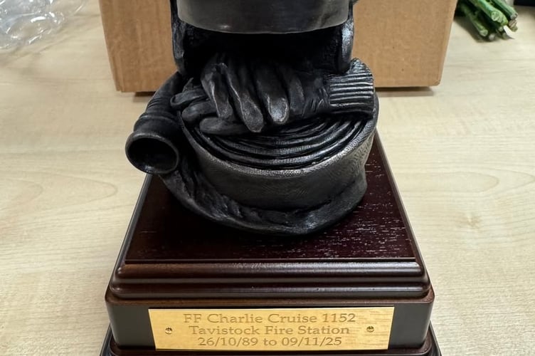 Retiring Tavistock Firefighter Charlie Cruise was presented with this trophy to mark his long service and retirement.