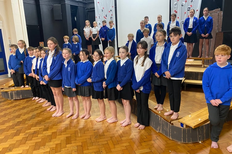 Tavistock Primary School's pupil Big Choir rehearses it's poignant concert - a tribute to their own relatives who died in war for their country.