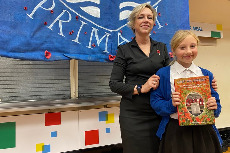 Tavistock music teacher Lisa Base and school choir member Aubree-ena, 10, who sings in the school's remembrance concert. Aubree-ena's great, great grandfather served in WWI and died fighting in WWII. His story features in the concert.