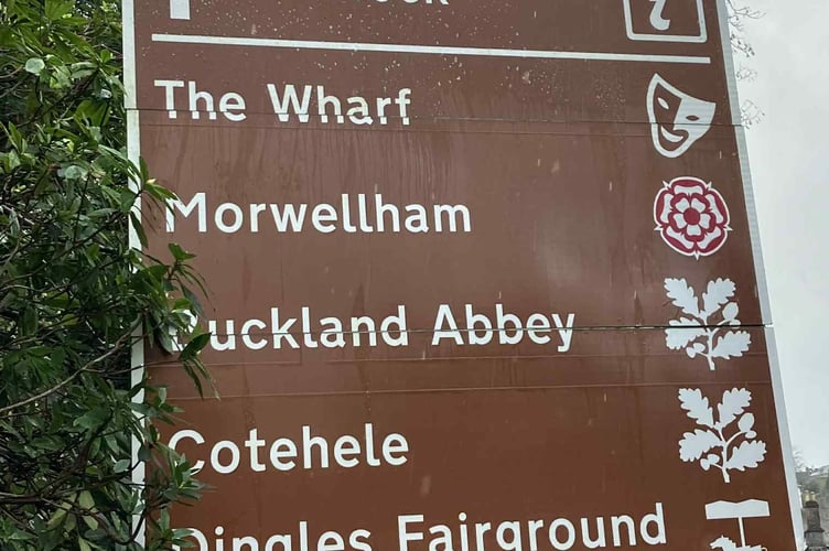 After Allen Lewis' attentions - a newly scrubbed tourism sign.