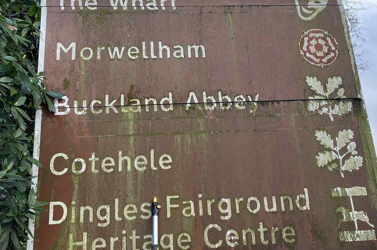 Before Allen Lewis' attentions - a grubby tourism sign.