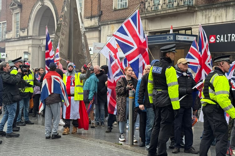 British Unity Walk members walked up the High Street but were kept to the pavement for much of it by police.  AQ 8797
