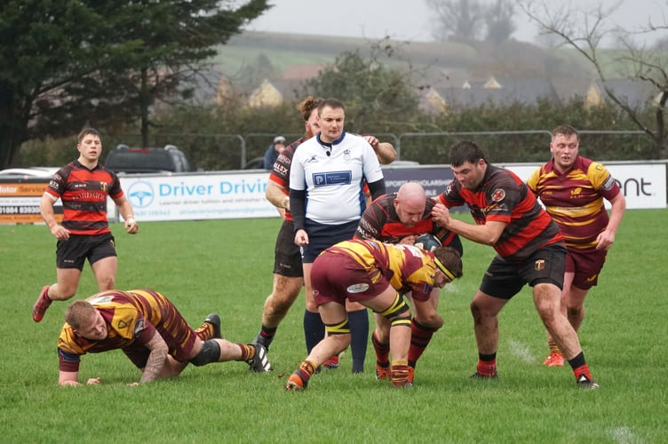 Okehampton lock Sonny Luxton halts the progress of Cullompton centre James Shere. Picture: Reith May.