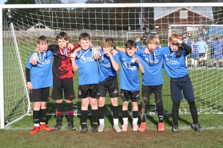 Tavistock Primary's football team celebrate qualifying for the county primary school finals in the New Year.