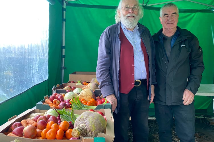 Roger Croxson and XX handing out fruit and veg at Tavy Helps.