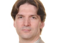 New conductor swinging baton for new singers