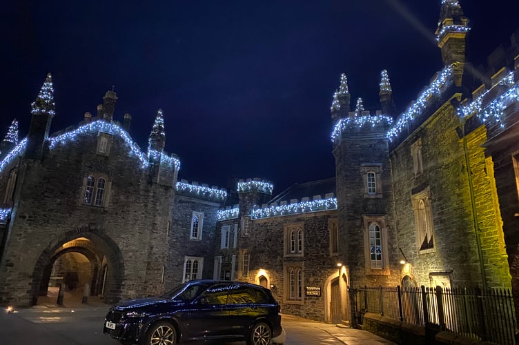 Tavistock Town Hall and Guildhall complex outlined in festive lights.