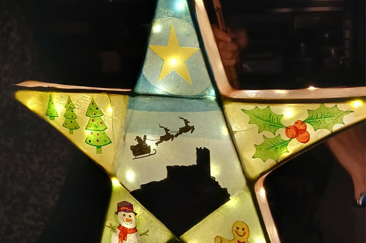 A Brent Tor church and Santa lantern made at workshops for the Tavistock Dickensian Evening parade. The sessions were held by West Devon Community Art Workshops.