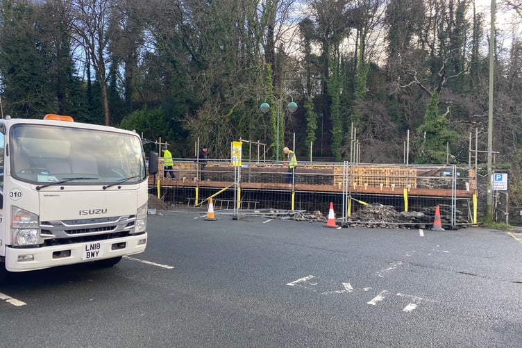 West Devon Borough Council works team rebuilding the riverside wall after removing damaging trees.