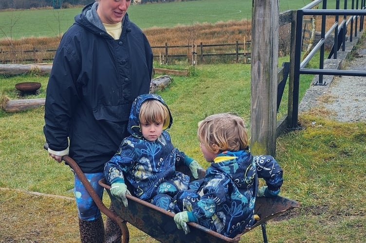 One of the award-winning Princetown community gardeners wheels her little helpers for a rest after hard digging.