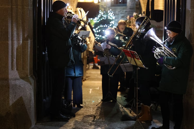 Stannary Brass Band accompanies the carol singing at Tavistock Lions Trees of Light switch-on. Picture by Chris Cottrell.