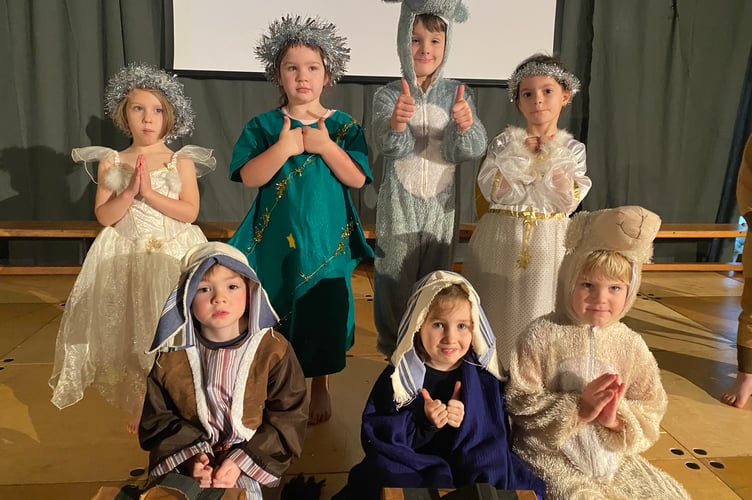 Horrabridge Primary and Nursery Nativity scene with angels, camel and Mary and Joseph.
