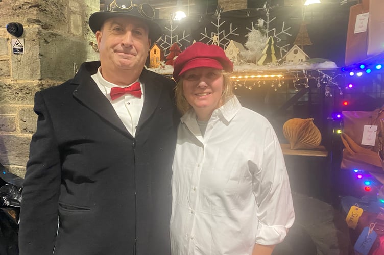 Tavistock Dickensian Evening - a couple of pannier market traders dress up in the spirit of the past.