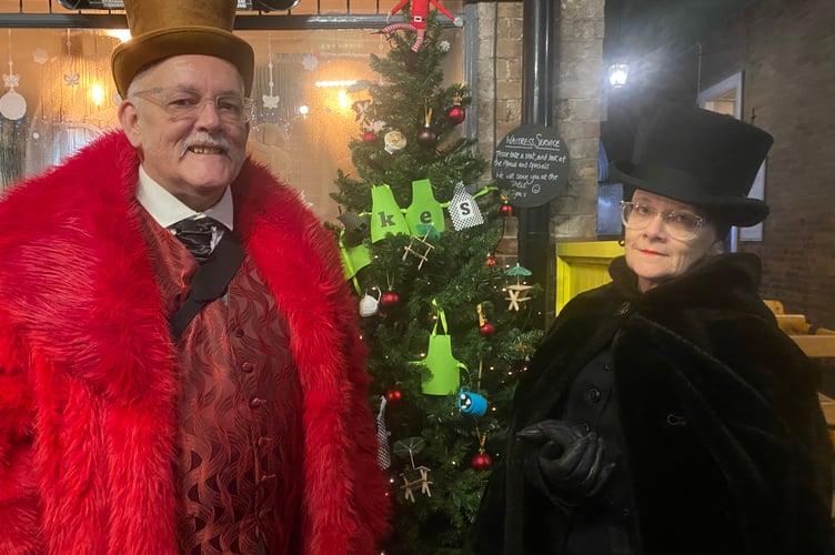 Tavistock Dickensian Evening - a couple dress up in the spirit of the past.
