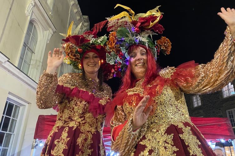 Tavistock Dickensian Evening - stilt walkers entertain from on high.
